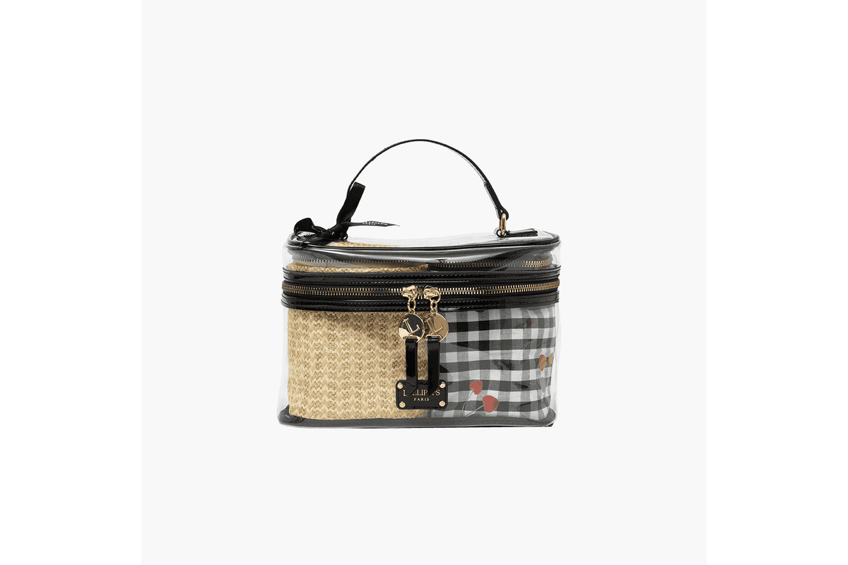 Vanity Sweetie noir Lollipops posé sur une commode claire, format trousse compact et anse cordelette