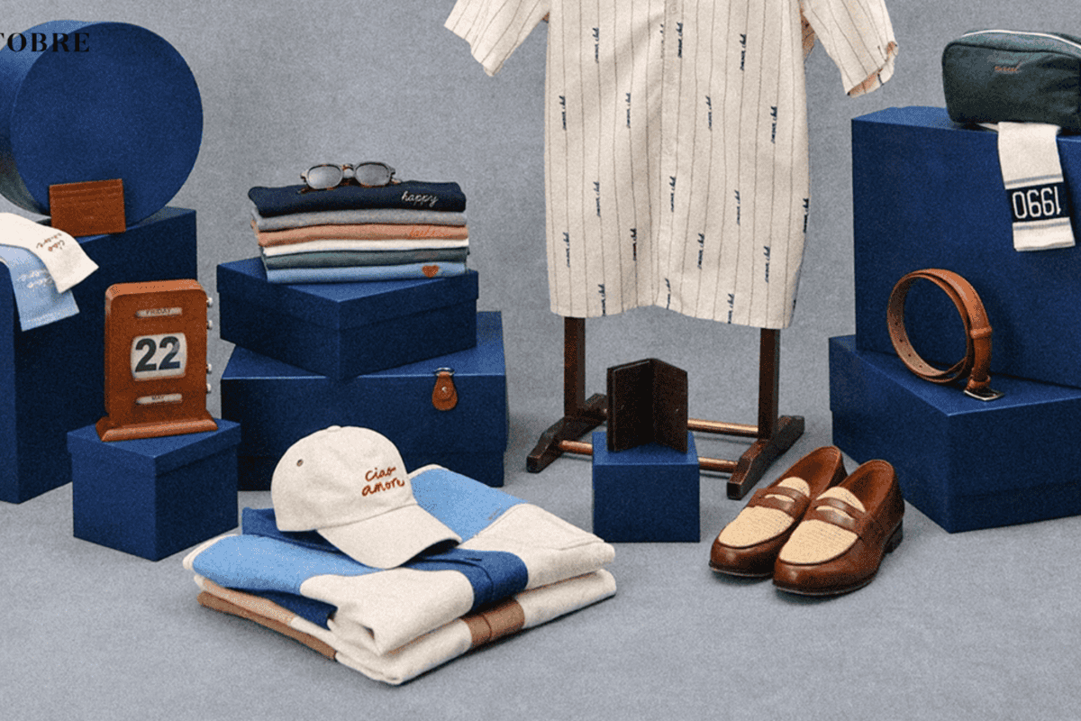 Concours Octobre Éditions « DITES-LEUR AVEC… » Fête des Pères 2026 : 6 bons d'achat de 500 € à gagner sur octobre-editions.com et en boutiques, sélection mode masculine premium (chemises, sneakers, ceintures, casquette, sacoche) sur fond bleu marine — inscription gratuite jusqu'au vendredi 19 juin 2026