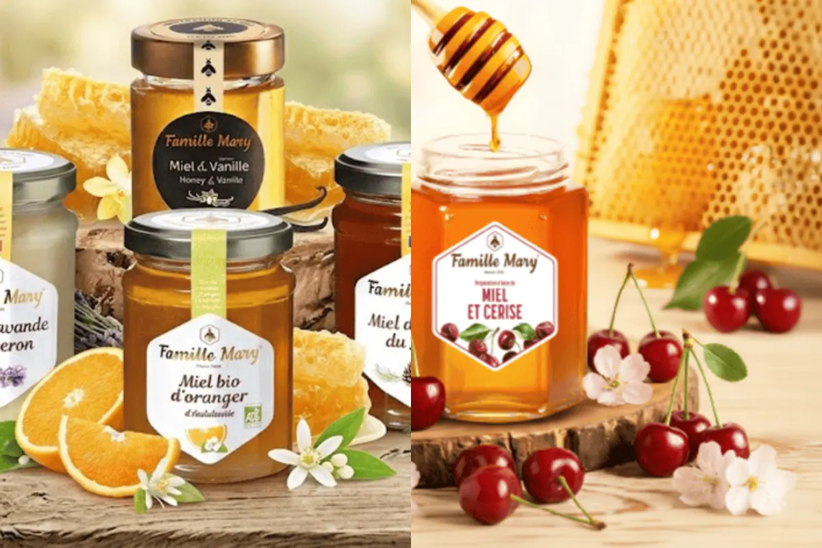 Pots de miel Famille Mary : miel bio d'oranger, miel à la vanille et miel de lavande du Luberon avec leurs rayons de cire, à côté du pot de préparation miel et cerise