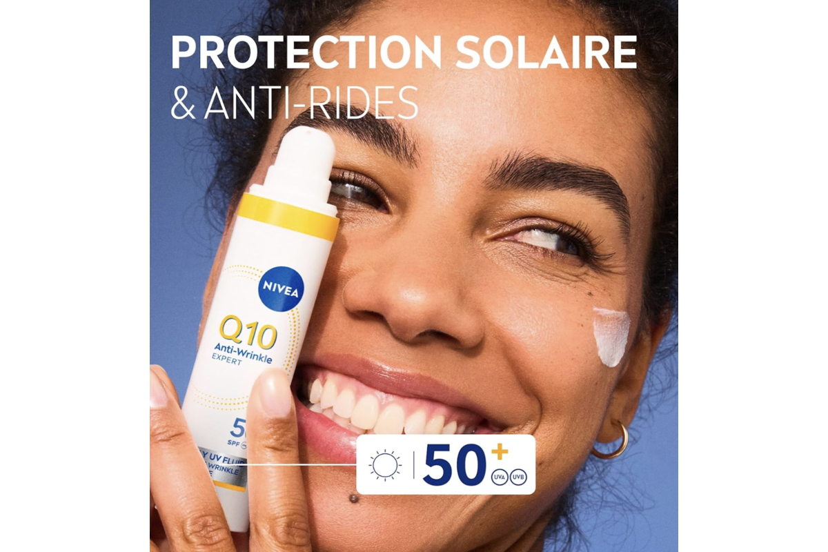NIVEA Q10 Anti-Rides Expert SPF50 en application sur le visage — protection solaire et anti-rides