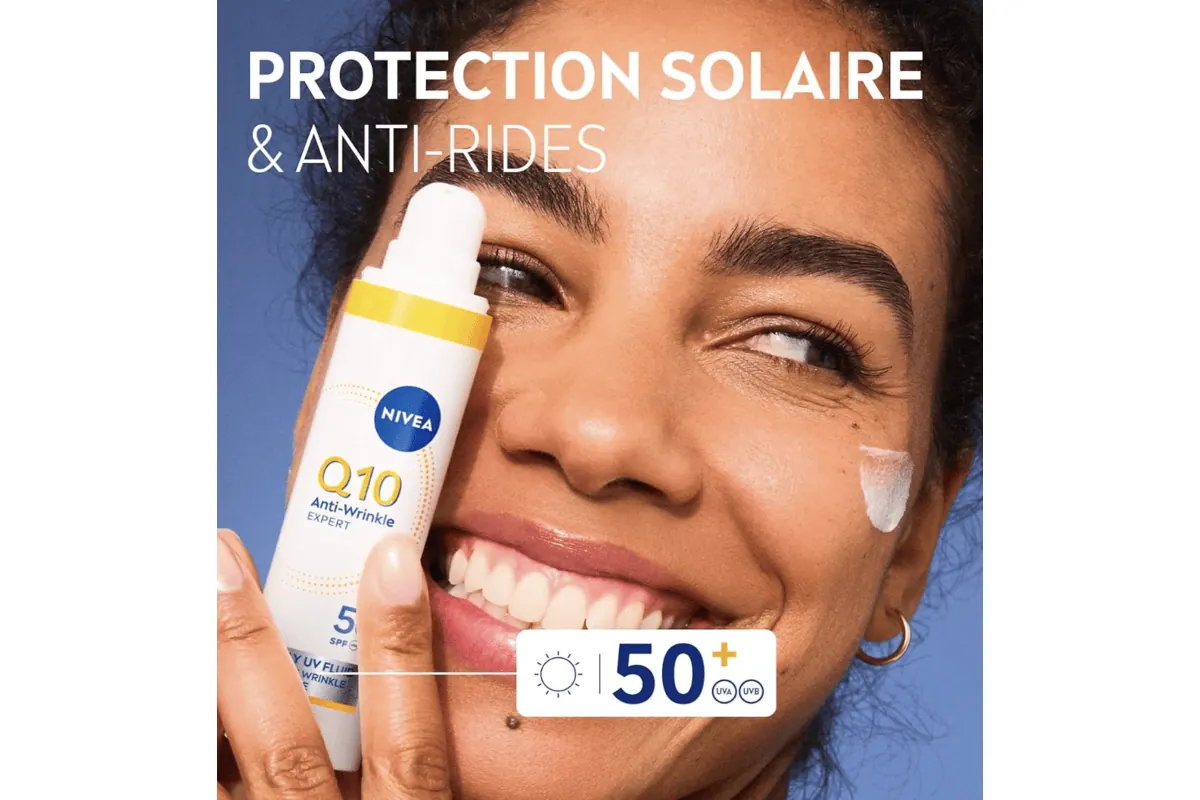 NIVEA Q10 Anti-Rides Expert SPF50 en application sur le visage — protection solaire et anti-rides